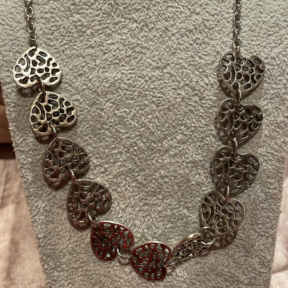 Lots of hearts necklace 18-20” safari style patterned hearts Stainless steel